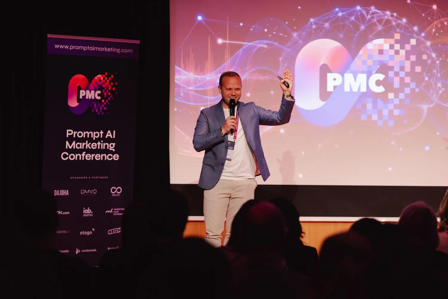 David Johansson speaking with a microphone on stage at the Prompt AI Marketing Conference in Vienna